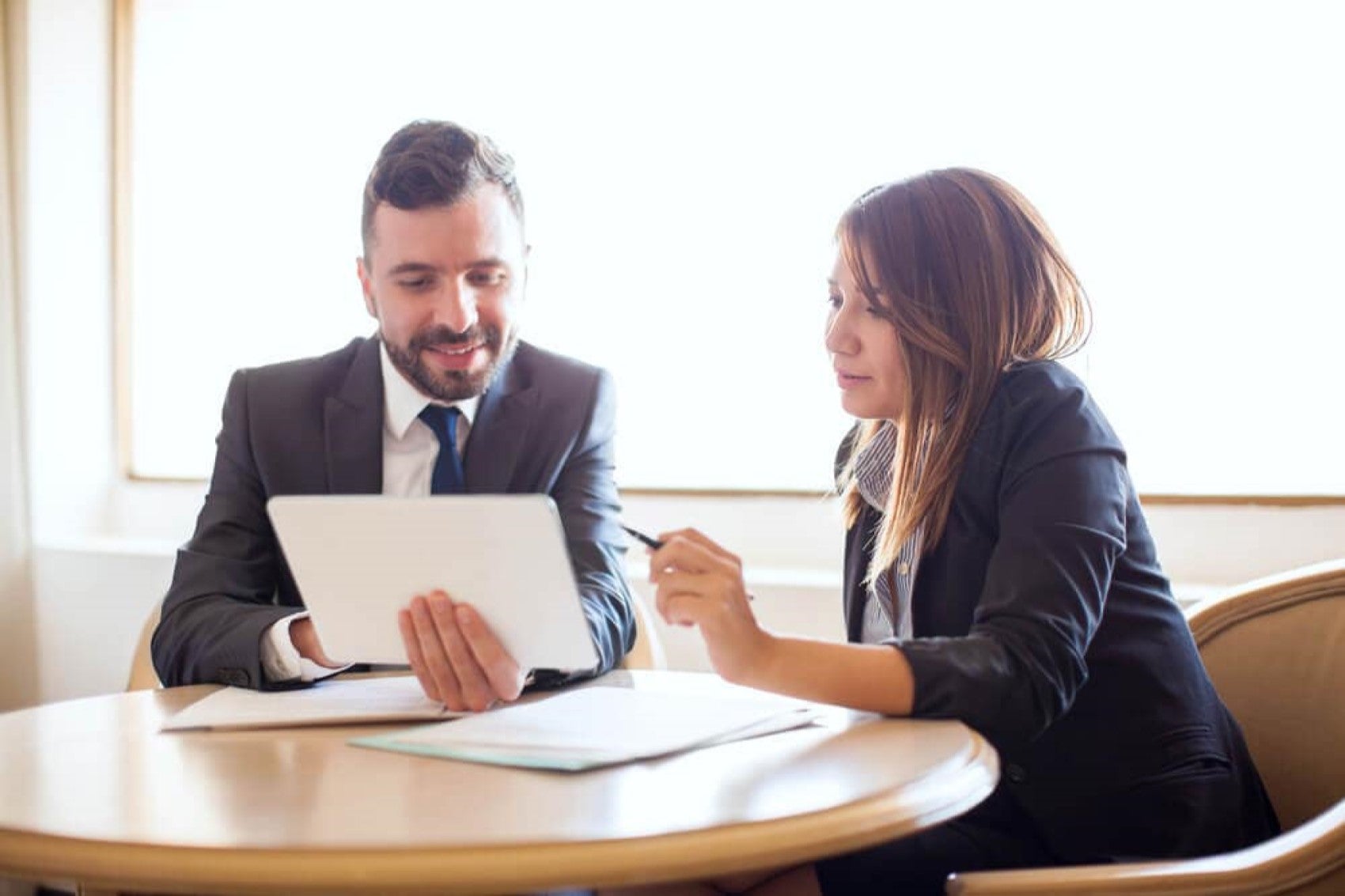 finance managers talking over paperwork